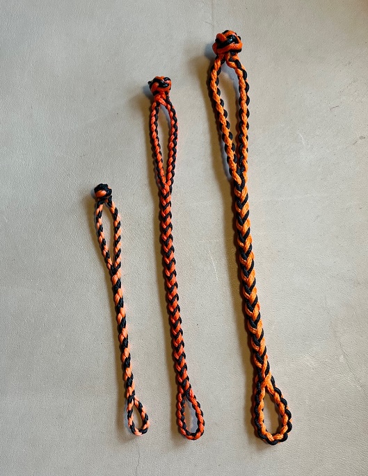 NEW EIGHT STRAND ROUND BRAIDED JESS EXTENDERS IN THREE SIZES, COLOR IS BLACK AND ORANGE.
